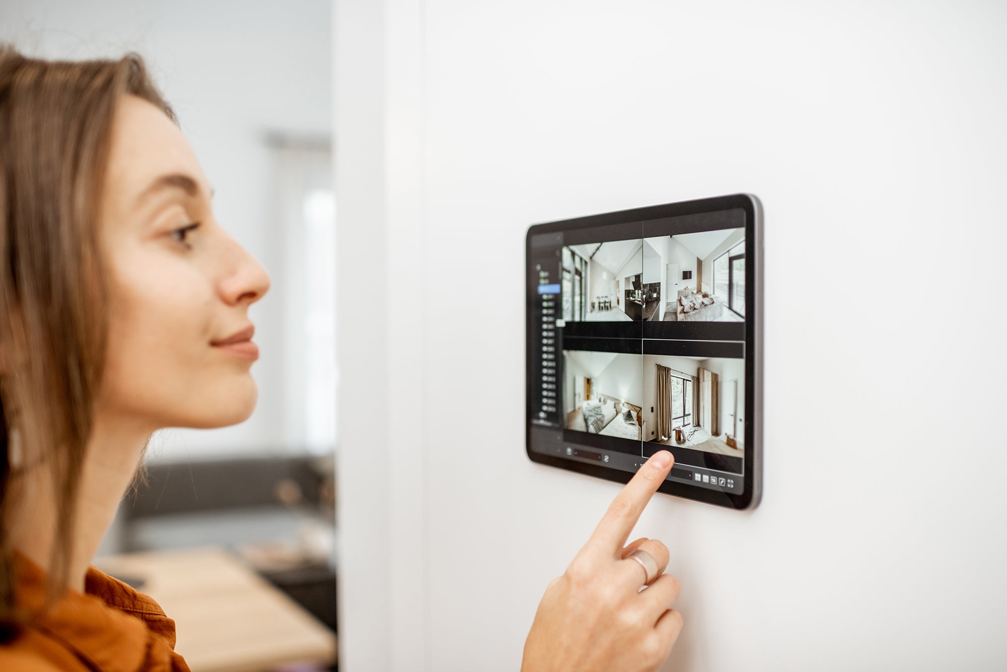 woman-controlling-home-with-video-cameras-and-digi-2021-09-01-14-47-46-utc.jpg